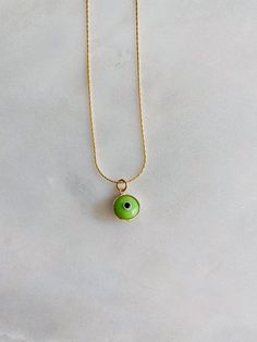 "It's all in the lil details💚 Gorgeous vibrant green evil eye on our gold plated gold snake chain. Such a fun piece to layer with⚡️ Length: 14-17\" adjustable" Green Adjustable Chain Charm Necklace For Everyday, Everyday Green Round Pendant Charm Necklaces, Everyday Green Round Pendant Charm Necklace, Adjustable Necklace With May Birthstone, Green Charm Necklace With Adjustable Round Pendant, Green Charm Necklace With Round Pendant And Adjustable Chain, Green Charm Necklace With Adjustable Chain For May Birthstone, Green Gold-plated Charm Necklaces With Adjustable Chain, Trendy Green Charm Necklace For Gift