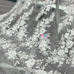 repeated floral pattern lace material by the yard White Scalloped Lace Embroidered Fabric, White Embroidered Lace Fabric, White Lace Embroidered Fabric, Cream Lace Fabric With Floral Embroidery, Edge Embroidery, Bridal Lace Fabric, Embroidery Floral, Lace Material, Floral Bridal