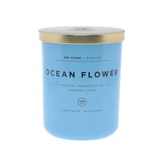 the ocean flower candle is in a blue tin