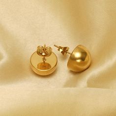 There is no better way to achieve classic and timeless elegance with a pair of half ball studs. A staple for every woman's wardrobe. Perfect wearing alone or layering with other earrings. Sophisticated and modern these earrings will immediately become your daily-wear studs.- Metal: Stainless Steel.- Plating: 18K Gold Plated .- Available Size: 12 mm.- Closure: Push Back Post.Ships in a Balara Gift Pouch.Available in Gold.SKU# EC109 Ball Stud Earrings, Stainless Steel Plate, Gift Pouch, Steel Plate, Women's Wardrobe, Daily Wear, Timeless Elegance, Gold Plate, Layering