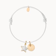 Playful and pretty, this engraved Personalized Enamel Star Bracelet is perfect for anyone wanting to add a pop of colour to their bracelet collection. Choose from a range of braid colors and enamel stars, paired with your unique, hand-engraved message.18K Champagne Gold Plated or 925 Sterling SilverMini flat disc: 04 Diameter, 0.02 ThicknessMini Star: 0.4 x 0.4Braid made of durable, colourfast polyesterFully adjustable sliding knot fasteningHand engraved in our Paris workshopSent with love in a White Charm Bracelet With Star Charm As Gift, Adjustable White Bracelet With Star Charm, White Engraved Adjustable Bracelet, White Adjustable Engraved Bracelets, Adjustable Engraved White Bracelets, Adjustable White Charm Bracelet With Star Charm, White Enamel Bracelets For Gifts, White Enamel Bracelets As A Gift, Braid Colours