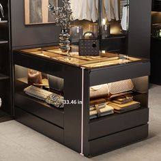 a black and gold dressing table in a room with pictures on the wall behind it