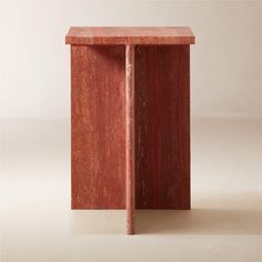 a red table with a wooden base on the top and one leg in the shape of a rectangle