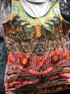 "Featuring my original batik Horses in the Moon, this equine inspired item of clothing is a comfortable fit and very stylish! Order a body hugging fitted tank top or a relaxed loose fitted one! Choose from regular (21.5\"-22.5\") or long fit (24\"-25\"). Pictured in regular fit. Choose the length you like! At this time only a large regular fitted tank is available. Choose a size up if you are in doubt! L (12-14) for 40\" bust, 31\" waist, 42\" hips * Custom made just for you, printed and sewn by Printed Stretch Tank Top For Summer, Summer Stretch Tops With Sublimation Print, Stretch Summer Tops With Sublimation Print, Summer Stretch Top With Sublimation Print, Fitted Printed Tank Top, Multicolor Stretch Tank Top With Graphic Print, Stretch Multicolor Graphic Print Tank Top, Multicolor Graphic Print Stretch Tank Top, Fitted Multicolor Tops With Digital Print