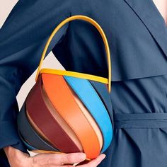 Unleash Your Style with a Splash of Color Introducing the latest must-have in your fashion arsenal - our Colorful Striped PU Leather Bucket Handbag. This eye-catching, barrel-shaped purse seamlessly blends functionality with a playful aesthetic, making it an ideal accessory for a variety of occasions. Whether you're stepping out for a casual day, heading to work, or going on a date, this handbag is designed to elevate your style statement. Product Features Vibrant Stripe Design: The patchwork pattern of vibrant stripes makes this handbag a statement piece that stands out. Quality Material: Crafted from premium PU leather, offering a sleek look with the durability to match. Versatile Carry Options: Comes with a top-handle and an adjustable long strap, providing the flexibility to use it as Playful Aesthetic, Bucket Handbags, Going On A Date, Patchwork Patterns, Leather Bucket, Mens Shoes Boots, Men's Backpack, Style Statement, Sleek Look