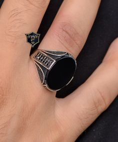 "Handmade Turkish Silver Ring, Men's Black Onyx Silver Ring, 925 Sterling Silver Ring, Classic Ring, birthday gift, dad gift ✦ Details ✦ * Material: 925 Sterling Silver * Gemstone: Onyx * Weight: 8.00 grams * The size of the stone: 15x20 mm. * Sides oxidized, decorated with Garnet stones and Micro Zircon stones. * Stamp: 925 * Available sizes; 5 US to 16 US. Contact me if you need any other size! ✦ Shipping ✦ * Processing time: 1-3 business days. * This item ships from my Turkish workshop in Istanbul. * Add your phone number in address box for a smoother delivery. That makes courier personnel's job easier.  ✦ Packaging ✦ * Comes with a luxury gift box and a jewellery cleaning cloth. ✦ Returns, Exchanges ✦ * Return option available for 30 days after the delivery. * The product has to be in Black Sterling Silver Jewelry For Father's Day, Father's Day Black Engraved Jewelry, Black Signet Ring With Polished Finish Gift, Elegant Black Jewelry For Father's Day, Black Sterling Silver Signet Ring For Gift, Black Sterling Silver Signet Ring For Anniversary, Engraved Black Rings For Gift, Onyx Silver Ring, Ring Collection