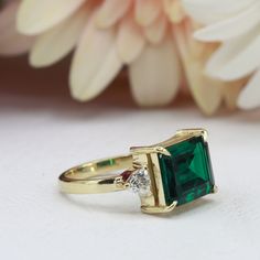 Square Cut Emerald Ring With Accent Stones For Wedding, Wedding Emerald Ring With Square Cut, Anniversary Emerald Ring With Bezel Setting, Rectangular Emerald Ring With Accent Stones For Formal Occasions, Rectangular Emerald Ring With Accent Stones For Formal Events, Square Cut May Birthstone Wedding Rings, Rectangular Birthstone Wedding Ring, Rectangular Birthstone Ring For Wedding, Wedding Rings With May Birthstone In Square Cut