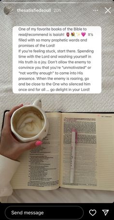 someone is reading the bible and holding a cup of coffee