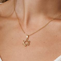 Adorn in style with this 14k gold-filled Star of David necklace. Fashionable Jewish Magen David pendant for women. Shower-safe, tarnish-resistant, adjustable chain--perfect for everyday elegance and gifting. Choose between: A stunning gold hue, crafted from 14K gold-filled material. An elegant silver shade, made of stainless steel with a rhodium cover. Elegant Star-shaped 14k Gold Filled Jewelry, Elegant 14k Gold Filled Star Jewelry, Yellow Gold Star Of David Jewelry With Delicate Chain, Classic Star Of David Jewelry For Gift, Elegant 14k Gold Star Of David Jewelry, Elegant 14k Gold-filled Necklace With Star Charm, Elegant 14k Gold Filled Necklace With Star Charm, Elegant Star Of David Necklace With Delicate Chain, Delicate Gold Star Of David Jewelry