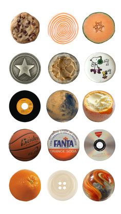 an assortment of different types of buttons on a white background, including oranges and cookies