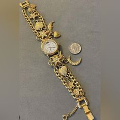 Vintage Rare Find Kirks Folly Crystal Rhinestone Dangling Charm Bracelet Watch. Size: End To End Is 7.75" Long. Wearing Length Is 7 Inches. The Longest Charm ( The Moon ) Is 1.75 Inches Wide. Dime In Picture For Size Reference Fold Over Snap Clasp Used But Fantastic Condition Needs Batteries Comes In Original Box However, Box Has Signs Of Wear And Tear( See Pic) Fairy Heart, Charm Bracelet Watch, Star Watch, Kirks Folly, Moon Star, Dangle Charms, Fold Over, Stars And Moon, Crystal Rhinestone