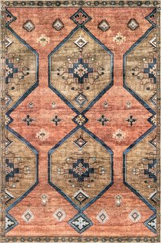 an orange, blue and brown rug with geometric designs on the bottom half of it