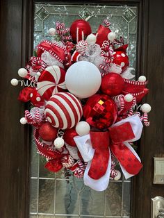 Check out this incredible red and white Christmas wreath we crafted! It's absolutely stunning and will bring so much festive cheer to your home. This luxurious wreath is adorned with a vibrant mix of red and white Christmas colors, meticulously handcrafted using designer ribbon, a variety of red picks, and high-quality shatterproof ornaments in different sizes and styles. It's the perfect way to add some jolly elegance to your front door or any wall in your home! ✨Get ready for the best part - w Red And Silver Wreaths, Red Christmas Wreaths, Bling Christmas Decor, Peppermint Christmas Wreath, Red Rose Christmas Tree, Christmas Decor Red And White, Red And White Christmas Wreath, White Wreaths, Peppermint Wreath