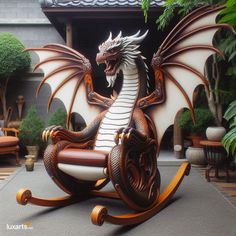 a statue of a dragon sitting on top of a rocking chair