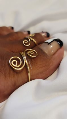 "Unique yet stylish toe rings that are delicately handmade and sure to bring a hint of beauty to whatever you pair them with. You have the option of a single toe ring or you can choose to purchase the bundle which is one big toe ring and one regular size toe ring for a discounted price. Choosing the bundle is the best deal for your buck. *All rings are made adjustable, you can size up or down by twisting inward or outward *Big toe rings are made at a size 12, regular toe rings are made at a size Gold Toe Rings, Rings Wire, Dope Jewelry Accessories, Dope Jewelry, Ring Simple, Toe Ring, Jewelry Lookbook, Handmade Wire, Wrapped Jewelry