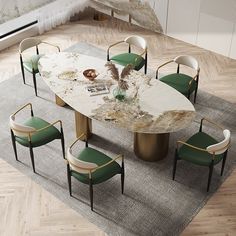 a marble dining table with green chairs around it