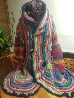 Bohemian Knitted Sweater Coat For Fall, Bohemian Yarn Outerwear For Winter, Bohemian Yarn Outerwear For Fall, Long Multicolor Bohemian Sweater Coat, Long Bohemian Multicolor Sweater Coat, Bohemian Long Multicolor Sweater Coat, Bohemian Hand Knitted Sweater Coat, Bohemian Winter Knit Outerwear, Bohemian Knit Outerwear For Winter