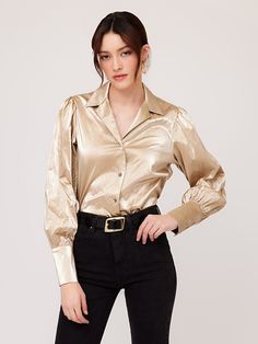 Exude confidence and charisma as you shimmer in the light creating a radiant and luxurious look with this beautiful top. Crushed Metallic: 50% Polyurethane 35% Viscose 7% Acrylic 5% Cotton 3% Metallic Made in USA Hand wash cold water. Hang to dry Length: 23 inches (size S) Notched collar Button up Shell buttons Style number: 4F19046 Exude Confidence, Long Sleeve Button Up Shirt, Gold Dust, Shell Buttons, Notched Collar, Button Up Shirt, Up Shirt, The Twenties, Cold Water