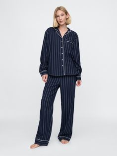 Soft cotton flannel pajama shirt and pants set.  Notch collar, button front.  Long sleeves.  Elasticized waist at PJ pants.  Assorted allover prints.  Note: This pajama set comes pre-wrapped and ready to gift for the holiday season.  Fit: Relaxed.  An easy silhouette throughout.  Models wearing Gap