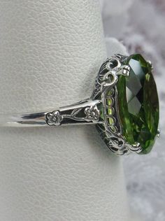 natural peridot ring, 5.5 carat natural gemstone, sterling silver floral filigree, Edward design #D70 Classic Green Filigree Ring With Gemstone, Elegant Green Filigree Ring With Gemstone, Elegant Green Oval Filigree Ring, Green Elegant Filigree Ring For Formal Occasions, Elegant Green Filigree Ring For Formal Occasions, Green Elegant Formal Filigree Ring, Green Sterling Silver Classic Filigree Ring, Classic Green Filigree Ring Hallmarked, Green Oval Filigree Ring In Sterling Silver