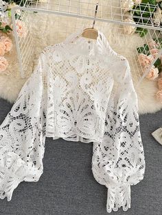 Upgrade your summer wardrobe with our Women Sexy Lace Hollow Out Short Blouse. The stunning lace and hollow-out design create a daring and alluring look that's perfect for a night out or any special occasion. The short length adds a touch of sexiness while the soft fabric ensures all-day comfort. Available in a range of colors to suit any style. Order now and turn heads everywhere you go this summer!Item Measurements(cm)One Size:Length:50 Sleeve:53 Bust:114 Waist:90Note:Measurements may exist 1- Top In Pizzo, Lace Lanterns, Short Blouse, Stand Collar Shirt, Lantern Sleeved Blouses, Short Blouses, Blouse Casual, Elegant Blouses, Elegant Red