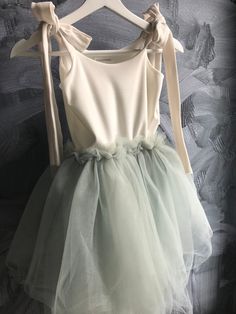 "A beautiful tutu dress great for any occasion! Birthday party, flower girl dress, ballet outfit or for dancing around at home!  Super soft jersey top fully lined with a soft tulle bottom. This dress has tie straps which makes it easy to adjust.  All dresses are made by hand by me only which makes each dress unique and one of a kind.  Please allow 1-2 weeks for production, dresses with intricate beading will take 3-4 weeks.  I am happy to make a custom order as well as add some sparkle or beadin Summer Ballet Tutu Dress For Dress-up, Sleeveless Tulle Tutu Dress With Bow, Spring Princess Tutu Dress With Bow, Spring Princess Style Tutu Dress With Bow, Fitted Sleeveless Tutu Dress With Bow, White Bow Tutu Dress For Summer, Spring Tulle Tutu Dress With Bow, Party Dresses With Bow Straps And Tulle Material, Summer Wedding Tutu Dress With Bow