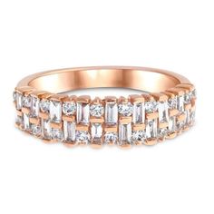 a rose gold ring with baguets and diamonds