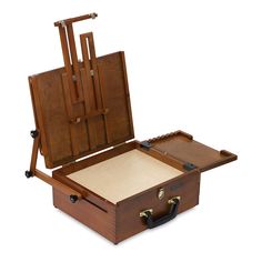 an open wooden box with two easels on it