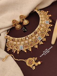 Description :- Beautiful Stylish choker/long matte golden necklace set/south indian wedding necklace with earrings/Traditional Temple Jewellery WEDDING Necklace Set, Wedding Necklace Set, Gold Plated Indian Jewelry Set, Necklace Earring Set, Party Wear Set, Indian Necklace Set Gift yourself a royal look with this perfectly crafted kundan necklace set from Manalisstudio. Crafted with high quality kundan stones and pearls, it is impressive in design. The green enamel artwork adds perfect texture t Kundan Meenakari Necklace For Marriage, Heavy Kundan Temple Necklace For Marriage, Bridal Necklace Indian, Wedding Necklace Set, Jewellery Wedding, Kundan Choker, Bridal Necklace Set, Necklace Indian, Golden Necklace