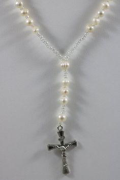 Thank you for looking at this listing!Up for sale is:Silver Tone 6mm Ringed Baroque Pearl Bead Y Necklace Cross Crucifix Catholic Christian Jesus PendantUsed, please see pictures for details on condition.I'm not an expert in rating condition, so please look carefully at the pictures and ask questions.What you see is what you get, sold As-Is.Shipping only within the United States. If you win multiple listings, I can combine shipping costs as long as items are paid for within 5 days of the first l White 8mm Beads Jewelry For Anniversary, Elegant Beaded Rosary For Jewelry Making, Adjustable Elegant Rosary, Elegant Adjustable Rosary, Elegant Pearl Rosary With 8mm Beads, Elegant Adjustable Rosary With Polished Beads, Elegant Adjustable Rosary With Silver Beads, Elegant Pearl Rosary With Round Beads, Elegant Adjustable Silver Beads Rosary