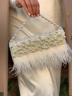 "Fancy slim wedding clutch is handmade and decorated with lace, pearl beads, and ostrich feathers embellishment on the front. The glamorous and vintage-looking small bridal handbag will be a great addition to your amazing look on the Special Day! The tiny elegant evening bag has a fold-over cover with sewn manually pearls, sequins, clear crystals, and ostrich feathers. The luxury handbag closes with a magnetic clasp. It will be a great accessory addition to the bride's outfit. The delicate women Elegant Cheap Evening Bag For Events, Affordable Glamorous Wedding Shoulder Bag, Luxury Cream Bags For Formal Occasions, Luxury Elegant Satchel For Formal Occasions, Luxury Party Bags With Fold Over Clasp, Luxury Chic Satchel For Party, Luxury Evening Clutch With Fold Over Clasp, Elegant Luxury Flap Bag With Fold Over Clasp, Trendy Luxury Evening Flap Bag