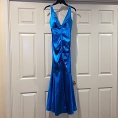 Never Worn Beautiful Blue Long Formal Gown. It Is A Fit And Flare Style. Very Sliming! Blue V-neck Prom Gown, Fitted Blue Satin Evening Dress, Blue Satin Prom Evening Dress, Blue Fitted Gown For Prom Season, Fitted Royal Blue Satin Gown, Blue Fitted Gown For Prom, Blue V-neck Gown For Prom Season, Fitted Blue Gown For Prom Season, Blue Maxi Dress For Prom Season