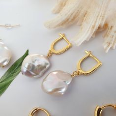 Keshi pearl earrings, Baroque earrings, huggie hoop earrings, Bridesmaid gift, Real pearl earrings, pearl drop earrings, freshwater pearl earrings, cubic zirconia hoops, modern earrings, pearl hoop earrings, baroque pearl hoops, Gift for her, bridesmaid gift ideas. A pair of unique pearl earrings for brides, bridesmaids..Irregular shapes gives classic pearls a more modern update. Pearls have evolved into one of the most popular trends that started in 2020 and they're going to maintain their plac Unique Pearl Earrings, Keshi Pearl Earrings, Baroque Earrings, Earrings Pearl Drop, Real Pearl Earrings, Popular Trends, Jewelry Real, Irregular Shapes, Baroque Pearl Earrings