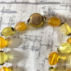 Vintage 1950s beaded necklace signed MADE AUSTRIA Box closure Please see photos for measurements Good condition Unique and fun piece! -: ✧ :- More Vintage Jewelry: https://www.etsy.com/shop/ElectricEyeThrift?section_id=26028118 ✶ VINTAGE ✶ Please note that this item is vintage. Wear and tear representative of its age may be present. Anything major will be in the description, but please look closely at the photos. Feel free to send me a message or request additional photos. Thank you! Handmade Vintage Yellow Beaded Necklaces, Vintage Orange Necklace With Faceted Beads, Vintage Polished Yellow Beads Jewelry, Vintage Orange Hand-strung Beaded Necklaces, Vintage Hand-strung Orange Beaded Necklace, Book Locket, Orange Poppy, Puffed Heart, Long Chain Necklace