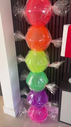 a stack of balloons sitting on top of a table