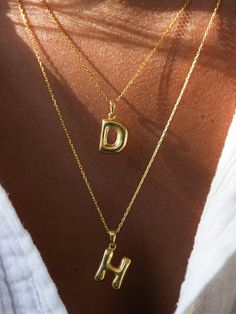 Material: High-quality, 925 Solid Sterling Silver over 14k gold plated or silver.  that ensure long-lasting wear. Chain Length: 16"+2" Elevate your style with our 3D Bubble Letters Necklace, featuring a charming hollow bubble letter initial pendant. This dainty layered necklace combines elegance and playfulness, perfect for adding a personalized touch to your outfit. Crafted with attention to detail, the balloon-inspired design offers a unique and trendy look. Ideal for everyday wear or as a thoughtful gift, this necklace highlights your initials or name with a fun, eye-catching flair. Embrace the beauty of custom jewelry with this versatile piece. Balloon Necklace, Letters Necklace, Bubble Letter, Bubble Letters, Necklace Dainty, Initial Pendant, Letter Necklace, Layered Necklace, Dream Jewelry