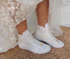 "There are many great benefits to wearing sneakers with your wedding dress - the most obvious is comfort. With a comfortable pair of tennis shoes on your feet, you will not have to avoid the track, you can easily do the laps at your reception and you will not wake up in the morning with unwanted blisters. The ivory lace with pearls in this dreamy couple is 100% worthy of a wedding. SIZE: Tip.. Its size Converse is smaller than other companies (eg. if you Nike wear 40, wear Converse 39) ★If you h Wedding Chucks Converse, Cream Wedding Shoes With White Laces, White Sneakers With Laces For Bridal Shower, Cream Wedding Shoes With Laces And Round Toe, Lace-up Wedding Shoes For Bride, White Round Toe Sneakers For Bridal Shower, Bride Wedding Shoes With Laces And Round Toe, Bridal Wedding Shoes With Laces And Round Toe, Bride's Wedding Shoes With Laces And Round Toe