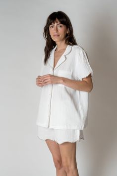 FINAL SALE The Alaia Pajama Set is made with 100% organic combed cotton, these are lightweight, comfy, and sustainable, making them the perfect addition to any sleepwear collection. With a unique scalloped trim for a touch of sophistication. Relaxed silhouette short sleeve Button front One chest pocket Scalloped edges at the sleeve and bottom of shorts Drawstring waist Kristen is 5'9" and wearing a size S/MSizes S/M and L/XL. Cotton Sleepwear With Relaxed Fit For Home, Relaxed Cotton Sleepwear For Home, Cotton Relaxed Fit Sleepwear, White Relaxed Fit Cotton Sleepwear, Relaxed Fit Cotton Sleepwear For Home, Comfortable Cotton Tops For Bedtime, Comfortable Cotton Bedtime Tops, Relaxed Summer Sleepwear, Relaxed Fit Sleep Top