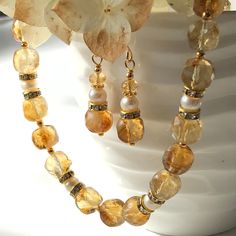 "7238 7239 Citrine Pearl Necklace Earrings natural yellow white gemstones boho statement choker dangle drops birthday anniversary Christmas holiday gift for her women mom sister wife girlfriend daughter niece aunt grandma cousin colleague best friend. Enjoy the beauty & power of natural gemstones.  This listing is for the NECKLACE or SET  Earrings listed separately at https://www.etsy.com/ca/listing/1592320917/citrine-pearl-earrings-natural-yellow?click_key=575dcc50f0db40e434962e291ea773a2caf391 White Dangle Jewelry With Gemstone Accents, Amber Jewelry With Faceted Beads For Gift, Yellow Dangle Necklaces As Gifts, Handmade Citrine Jewelry For Weddings, Yellow Teardrop Bohemian Jewelry, Yellow Gemstone Jewelry With Round Beads, Yellow Gemstone Round Beads Jewelry, Faceted Yellow Jewelry For Wedding, Gold Jewelry With Gemstone Beads For Anniversary