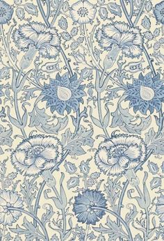 a blue and white floral wallpaper with flowers on it's side, in the middle