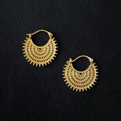 ❨ ❨ KĀLA Exclusive ❩ ❩ Afghan-inspired Hoops in 18k Gold plated on 925 Sterling Silver Lacework adornments Size: 3,2 cm x 3,5 cm 18k Gold plated is not Solid Gold and must be handled and treated with great care to preserve its quality. The durability of the plating varies depending on use, devotion to care instructions, climate, skin type and lifestyle. To maximize the durability of the plating: It is essential to remove your jewelry before sleeping, soaking in water, doing household chores, usi Intricate Brass Hoop Earrings, Vintage Round Hoop Earrings With Intricate Design, Brass Filigree Hoop Earrings For Wedding, Brass Filigree Hoop Earrings, Brass Hoop Earrings With Intricate Design, Brass Hoop Earrings With Intricate Design For Festivals, Metal Chandbali Hoop Earrings With Intricate Design, Intricate Chandbali Hoop Earrings, Festive Hoop Earrings With Intricate Design