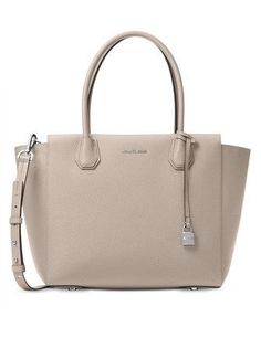 Classic sophistication translates into practical polish with spacious Mercer satchel. Made from luxuriously textured pebble leather, the Mercer can be worn on your arm by its double handles, or as a crossbody or shoulder bag by its long, slim detachable strap.Pebble leather; lining: polyesterLarge sized bag; 17-1/2"W x 11"H x 6-1/2"D7-1/2"L double handles; 17"L-19-1/2"L adjustable and detachable strapTop-zip closureExterior logo, feet and lock charm1 interior zip pocket and 1 slip pocketLaptop c Sac Michael Kors, Michael Kors Mercer, Bags Michael Kors, Michael Kors Outlet, Leather Satchel Bag, Pearl Grey, Satchel Handbags, Handbags Michael Kors, Leather Satchel