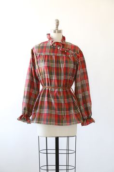 "Vintage 1970s Fall plaid blouse High neck ruffle neck + puff ruffle sleeves Great vintage condition M e a s u r e m e n t s: Size: fits like a M L BUST: 23\" Waist: 24\" Total length: 27 1/2\" Sleeves: 23\" Label: Lucky winner +All Measurements are taking while garment is lying flat+ + Jewelry, belts, and any other accessories are NOT included unless specifically stated in description+ i n s t a g r a m: cali_vintage_usa" Plaid Long Sleeve Blouse With Ruffles, Fitted Plaid Blouse For Fall, Plaid Ruffled Blouse For Work, Plaid Ruffle Blouse For Work, Vintage Plaid Spring Tops, Vintage Plaid Top For Spring, Fall Plaid Top With Ruffles, Fall Plaid Ruffled Tops, Retro Long Sleeve Ruffled Tops