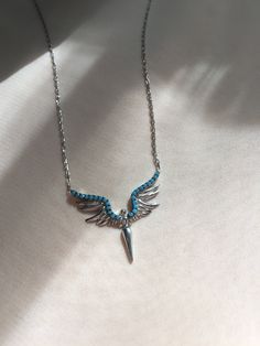 "Handcrafted in 925 sterling silver, our timeless and best selling \"Angel Pendant Necklace has Turquoise Gemstone version now!  Universally wearable, timelessly charming...Layer or wear individually!  This Silver Angel Pendant is crafted into the shape of an angel with wings signifying faith, devotion, hope, trust and love. The Turquoise Angle Necklace is skin-friendly and hypoallergenic, handcrafted from 925 sterling silver. The materials used are high quality and durable. The finish of this delicate angel gemstone jewelry is also silver. This beauty does not need a full stack, it is super pretty all by itself! You can wear it individually or as a layered necklace. This angel necklace is the perfect gift for a loved one, best friends, bridesmaids, sisters or mum on special occasions. As Sterling Silver Turquoise Necklaces Stamped 925, Turquoise Sterling Silver Necklaces Stamped 925, Turquoise Gemstone Necklace In Sterling Silver, Turquoise Sterling Silver Necklace Stamped 925, Sterling Silver Turquoise Gemstone Necklace Gift, Fine Jewelry Sterling Silver Turquoise Necklaces, Fine Jewelry Sterling Silver Necklaces In Turquoise, Turquoise Sterling Silver Fine Jewelry, Sterling Silver Turquoise Gemstone Necklace