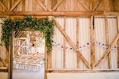 the inside of a barn decorated for a wedding