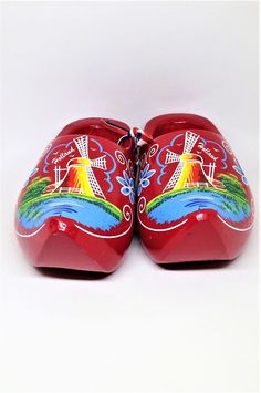 "Vintage Holland Shoes, Souvenir Shoes, Dutch Clogs, Red Holland Shoes, Floral Windmill, Holland Shoes, Klompenfabriek, Wooden Shoes Perfect collectible from Holland. Display piece. Very Colorful Dutch souvenir. Red Holland Clogs. Hang on the wall and fill with florals or greenery sprigs! Measures: 6\" long x 3\" wide each. Condition: Very good, Marked \"Holland\" near windmill. Please visit our shop to view our entire vintage selection at DartmouthHill: https://www.etsy.com/shop/DartmouthHill?r Dutch Shoes, Dutch Wooden Shoes, Dutch Clogs, Wooden Shoes, Holland, Clogs, Collectibles, Etsy Uk, Floral