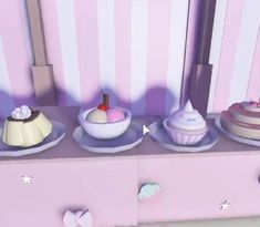 there are three different cakes on the dresser