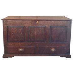 an old wooden chest with two drawers on one side and three doors on the other