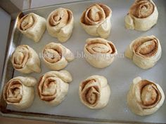 rolls on a baking sheet ready to go into the oven for making cinnamon buns