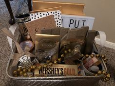 a basket filled with lots of different types of items on top of a carpeted floor